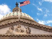 Washington DC Capitol dome close up with American flag flying