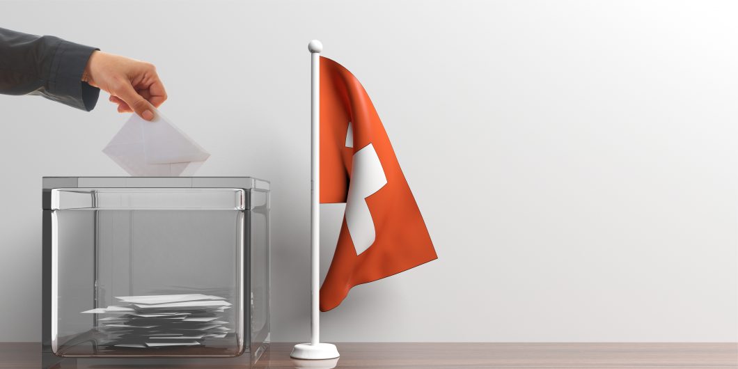 Ballot box and a small Switzerland flag. 3d illustration