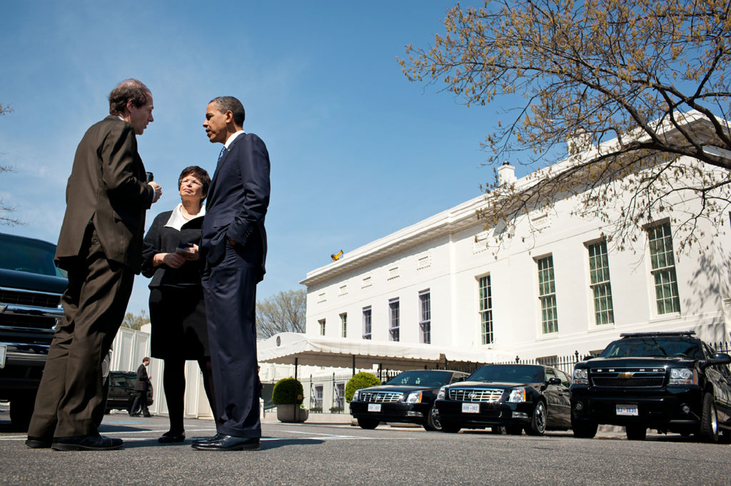 President Barack Obama talks with Cass Sunstein, Office of Information and Regulatory Affairs Administrator and Senior Advisor Valerie Jarrett on West Executive Avenue between the West Wing of the White House and the Eisenhower Executive Office Building A