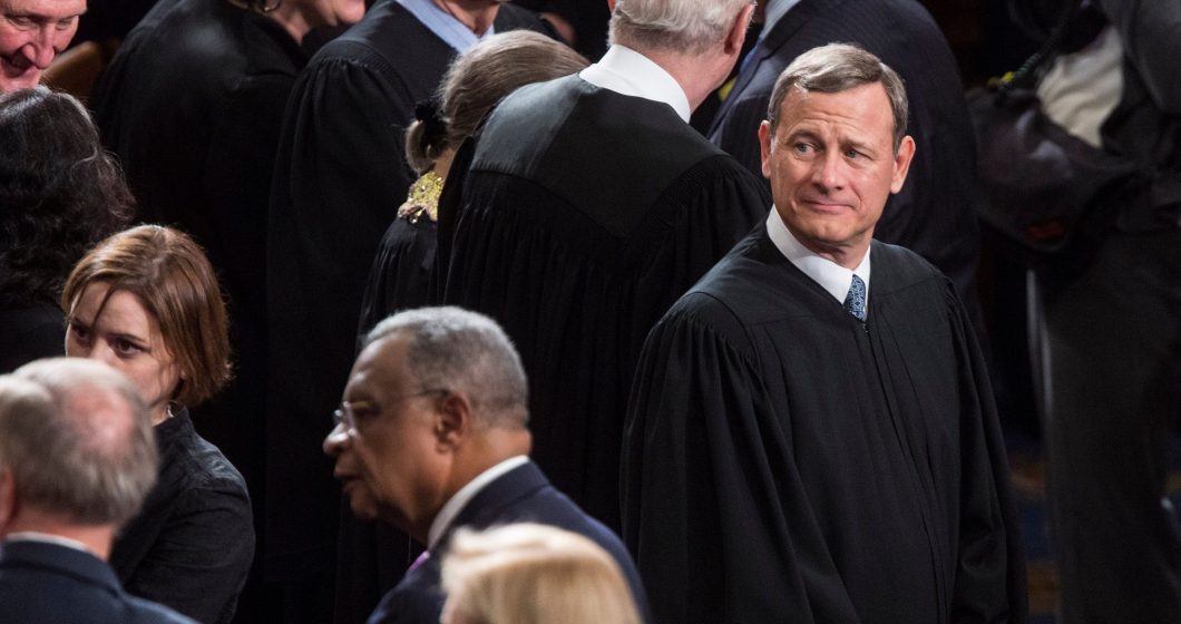 John Roberts, Chief Justice of the U.S. Supreme Court wait for the start of the State of the Union Address on Capitol Hill.