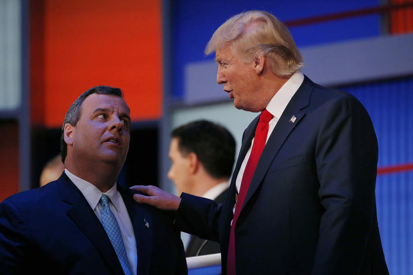 Republican 2016 U.S. presidential candidate Christie talks to fellow candidate Trump during a commercial break in the midst of the first official Republican presidential candidates debate of the 2016 U.S. presidential campaign in Cleveland