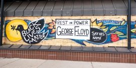 George Floyd “Rest in Power” “Black Lives Matter” “Say his Name” painted on plywood window. protectors. Minneapolis Minnesota MN USA