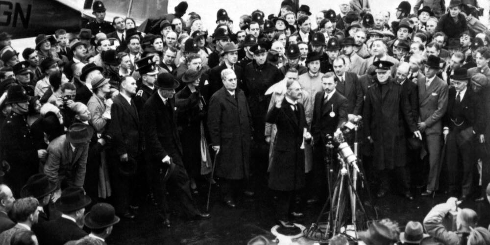 Neville,Chamberlain,Waving,His,Munich,Agreement,At,The,Airport,On