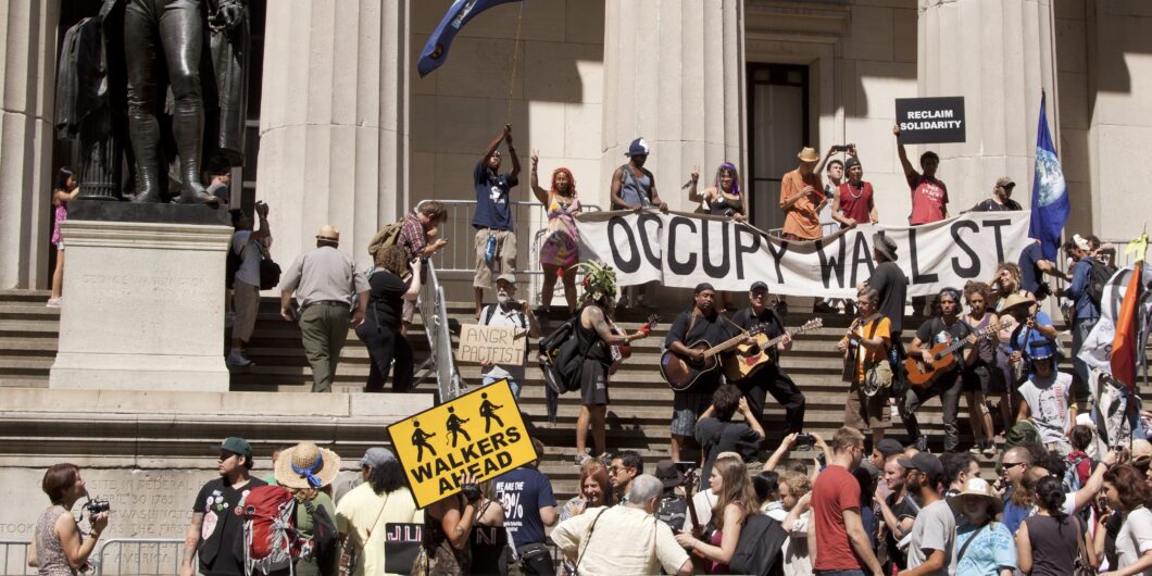New,York-july,11:,Occupy,Guitarmy,Protesters,Rally,And,Play,Music