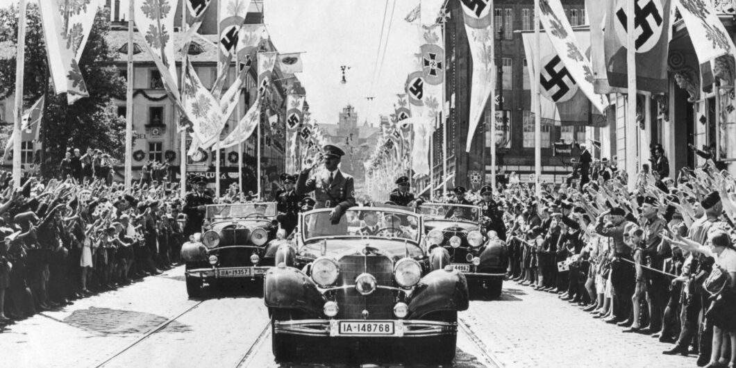 Adolf,Hitler,Waving,To,Crowds,From,His,Car,At,The