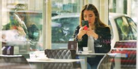 teenage girl on smartphone_shutterstock_2272618071