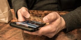 man holding smartphone_P00F1B